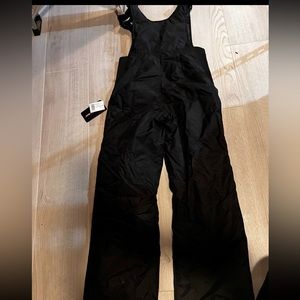 Size youth Medium. Insulated bib with durable water repellent snow pants.